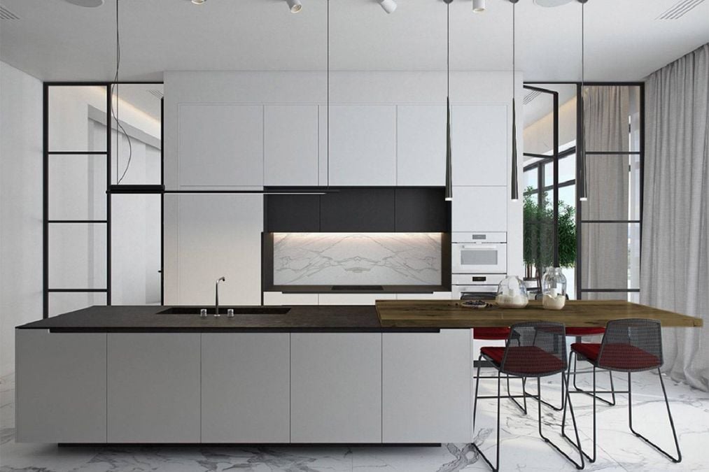 A wide shot of the kitchen section featuring a center island with shelves and wall-mounted kitchen cabinets.