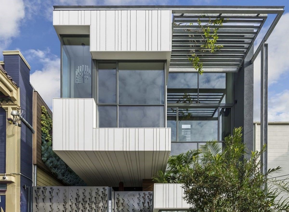 Tucked alongside a historic former union hall in the Mission District, this new three-unit building offers a warm and sophisticated presence while respecting the older neighborhood fabric.