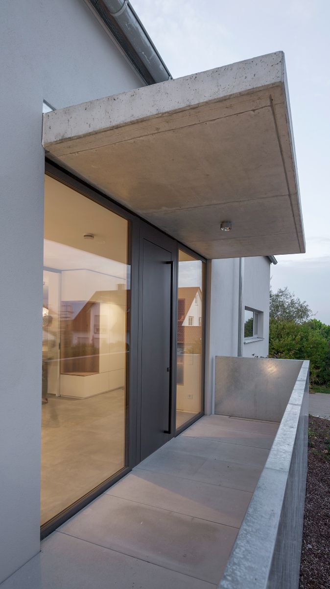 On the upper floor, there is a concrete terrace covered with concrete overhang. It has a panoramic view of the surrounding landscape.