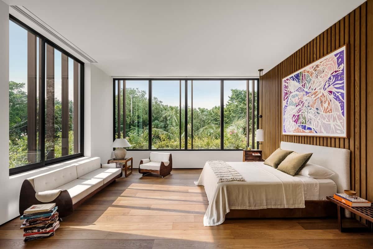 The private, upstairs bedrooms enjoy tropical views of the landscape.