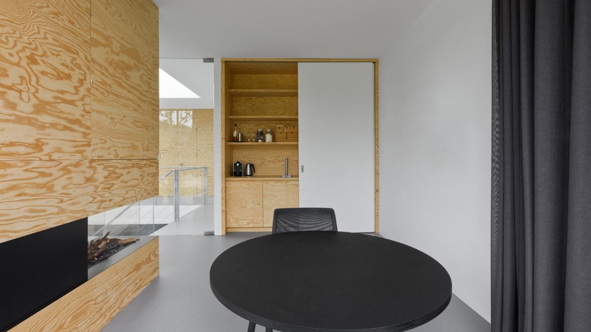 A single-person table with a lovely view of the outside is set up.