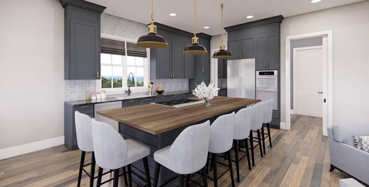 The kitchen has gray cabinetry and a cooktop island surrounded by upholstered bar stools.