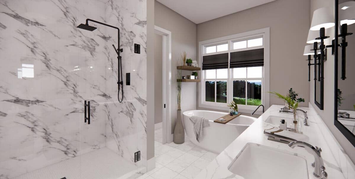 Marble tiles in the vanity countertop and walk-in shower add elegance to the primary bathroom.