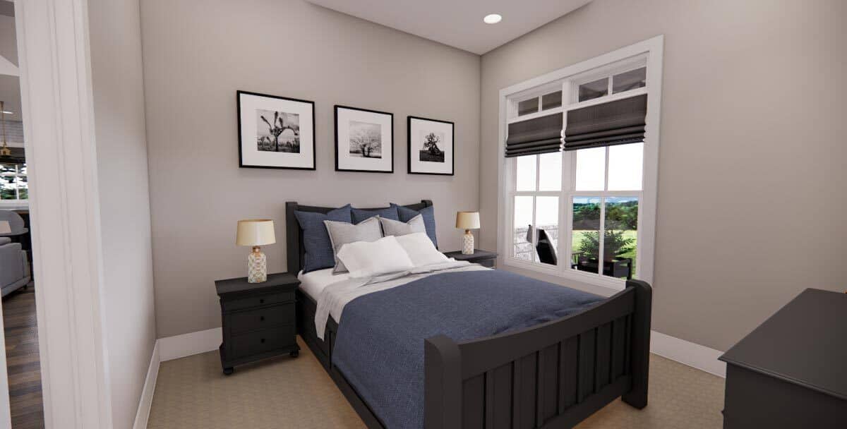 Second bedroom with dark wood furnishings and taupe walls lined with white base moldings.