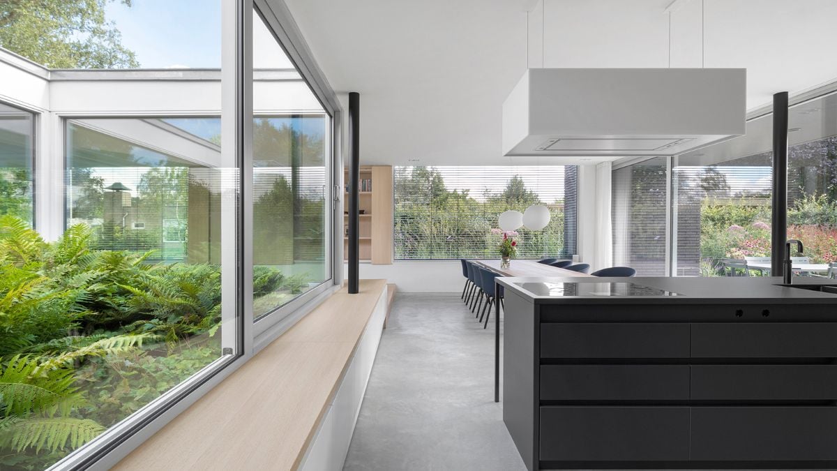 Featuring a heat pump, geothermal energy storage, and roof-mounted solar collectors.