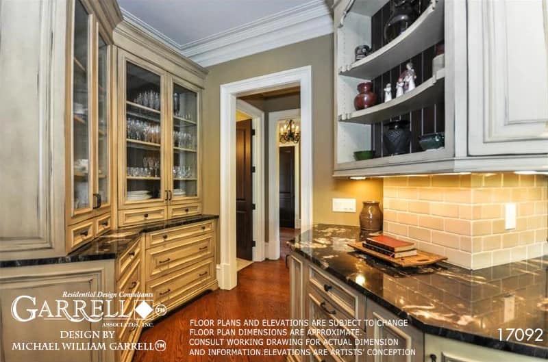 An open doorway provides the kitchen with easy access to the laundry room and mudroom.