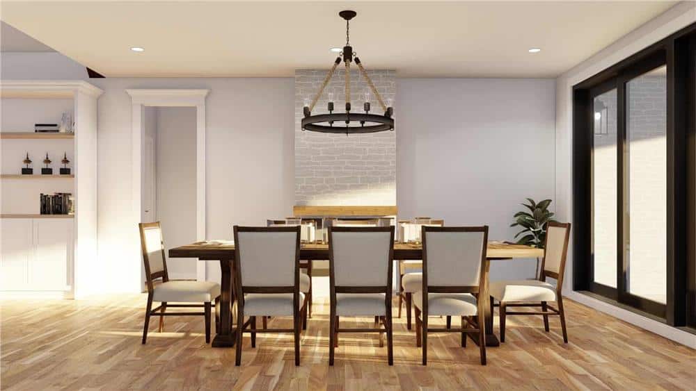 The dining area offers an 8-seater dining set topped with a round chandelier.