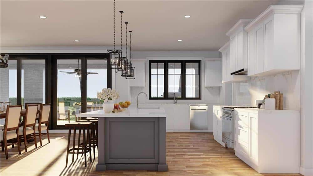 Glass sliders and a trio of windows above the sink bring natural light into the kitchen.