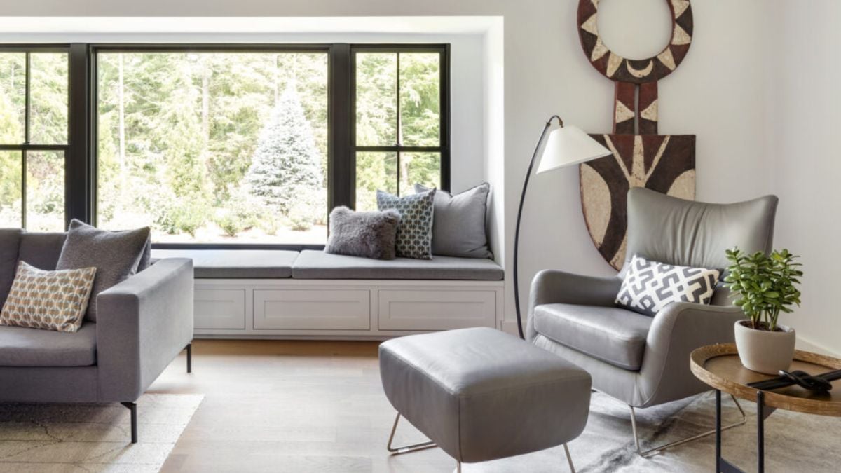 The living area has a beautiful design, and the seating is a tranquil gray tone.