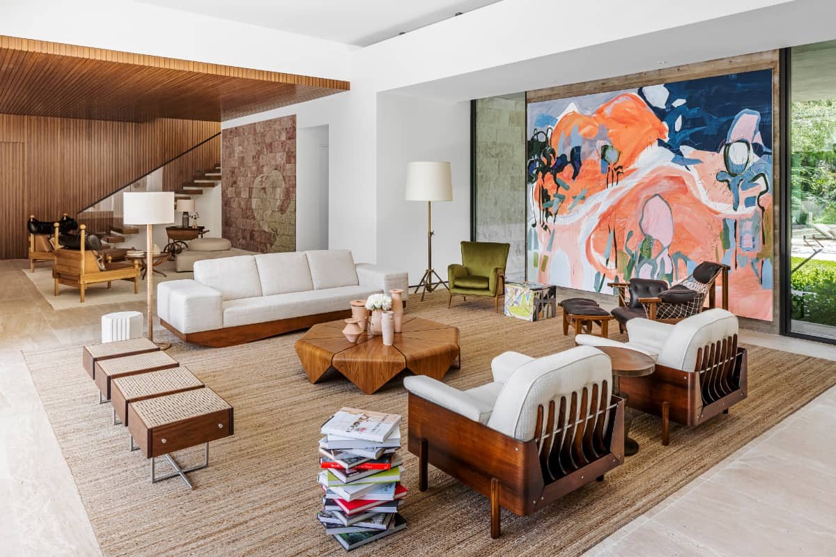 The well-appointed living room also serves as the entertainment hub for family and friends, in contrast to the more private realm upstairs.