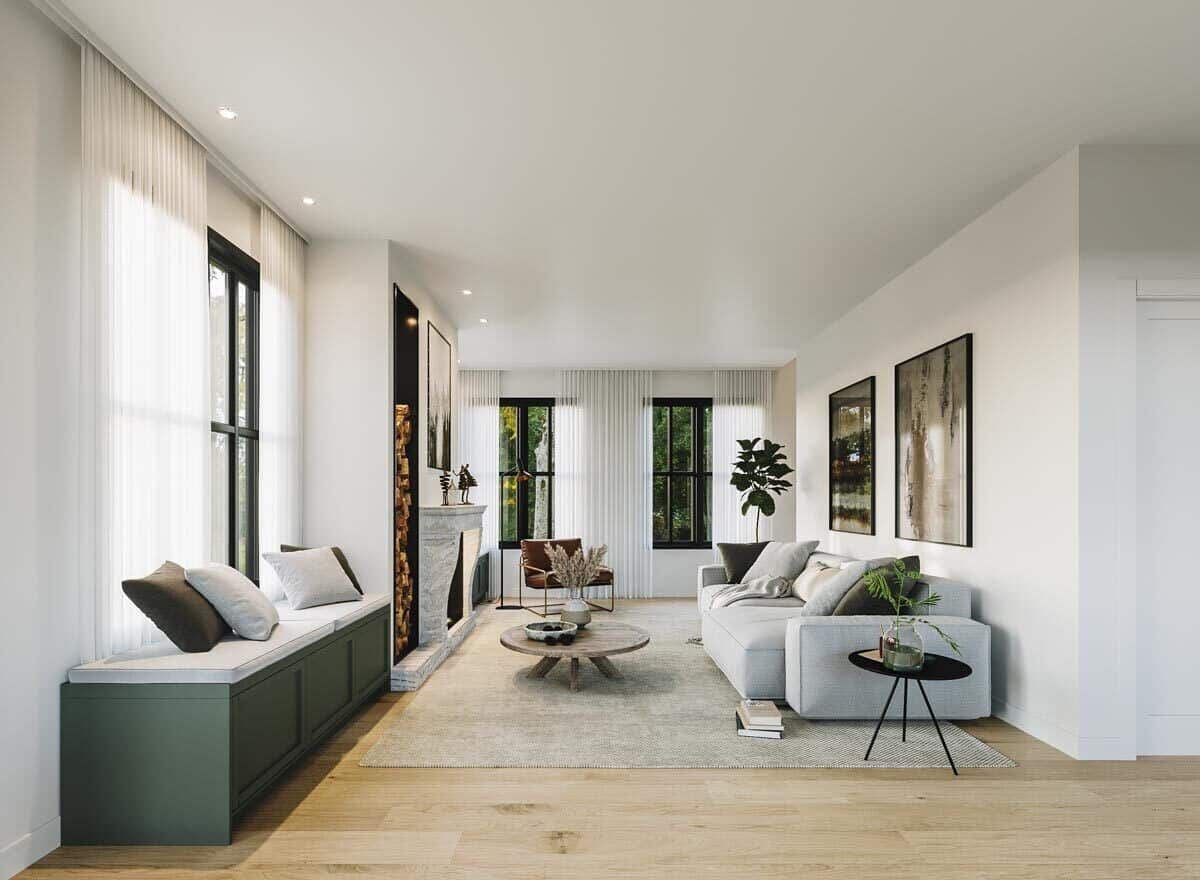 Aluminum framed windows flood the living room with ample natural light.
