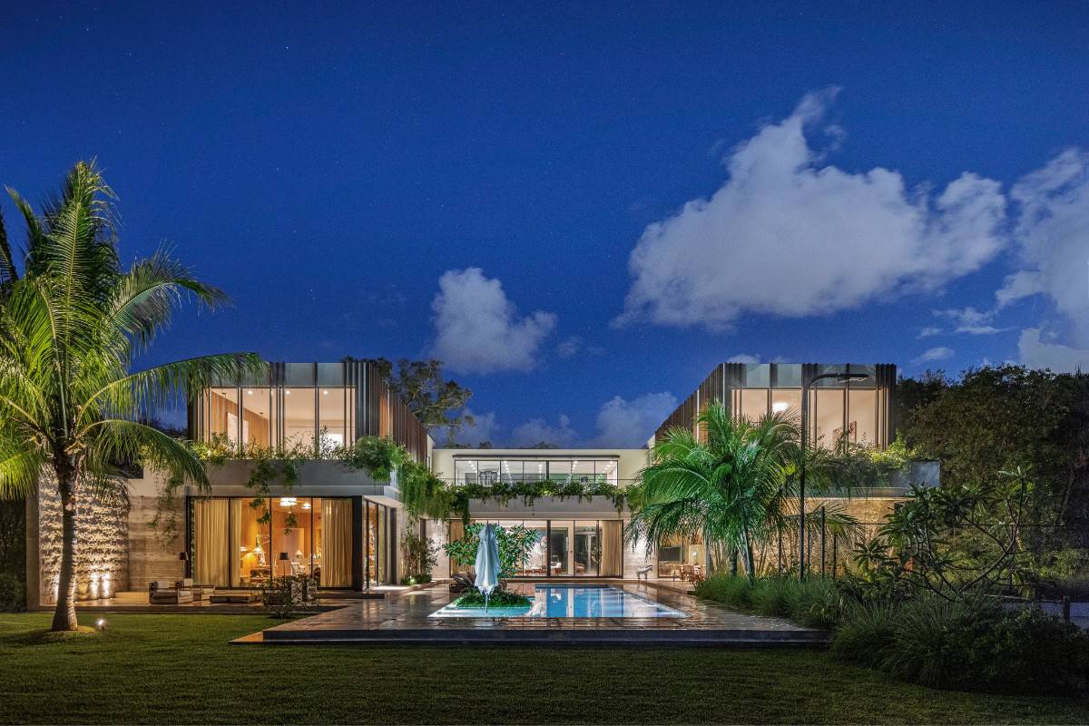 The H-shape footprint of the house glows at night.