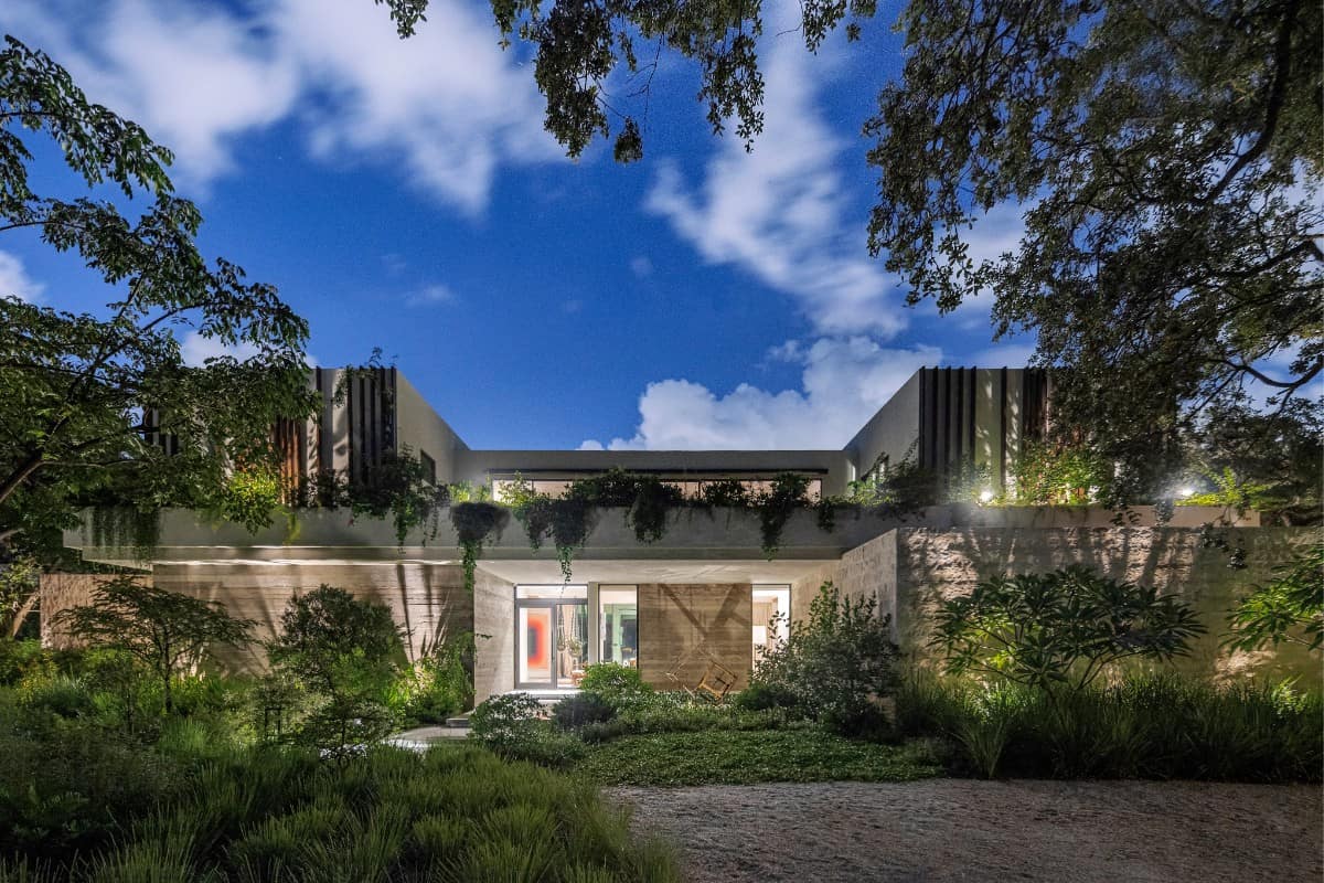The home's distinctive evening glow highlights its unique shape