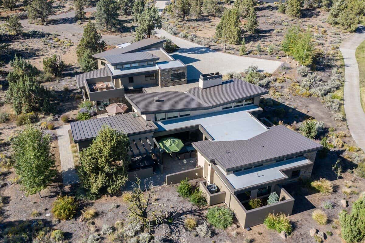 Aerial view of the house showcasing its metal roofs and private courtyards.