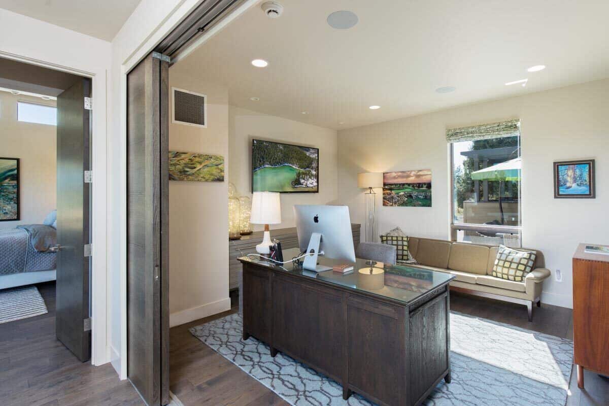Sliding doors adjacent to the bedroom reveal the home office.