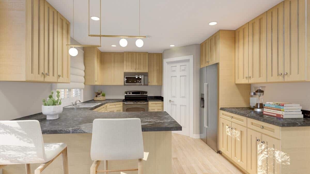 The kitchen is equipped with stainless steel appliances, marble countertops, wooden cabinetry, and a corner pantry.