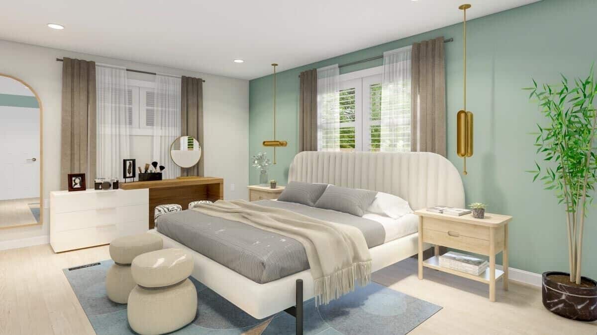 The primary bedroom has a light hardwood floor and a platform bed complemented with modern footstools.