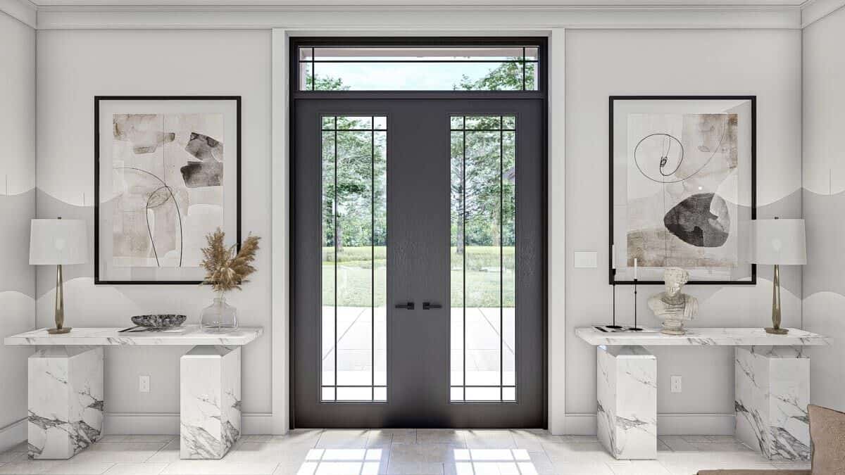 A French front door opens to the entry flanked by marble tables.