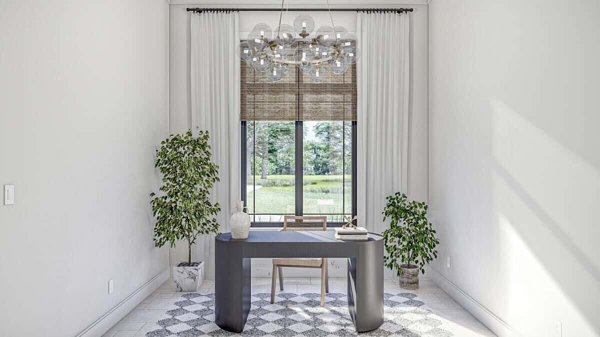 The home office features a contemporary desk topped with a glass globe chandelier.