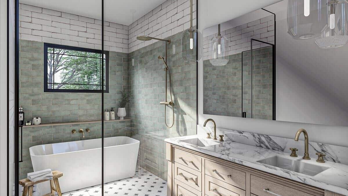 A framed picture window brings natural light into the primary bathroom.