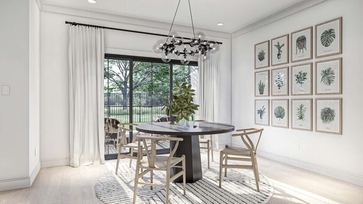 Dining area with a round dining set and sliding glass doors that open onto the back patio.