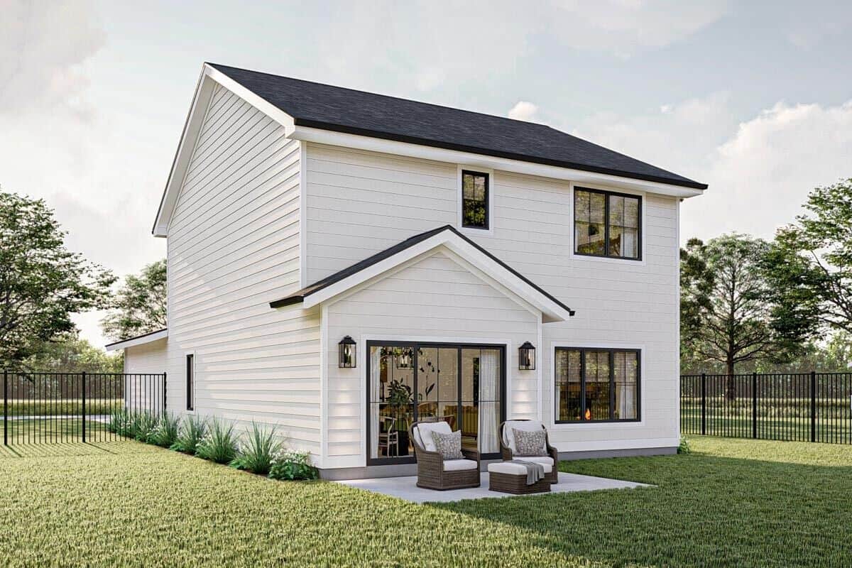 Rear-right rendering showcasing a concrete patio furnished with wicker chairs and a matching coffee table.