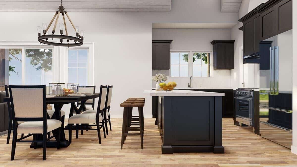 The breakfast island separates the kitchen from the combined living and dining rooms.