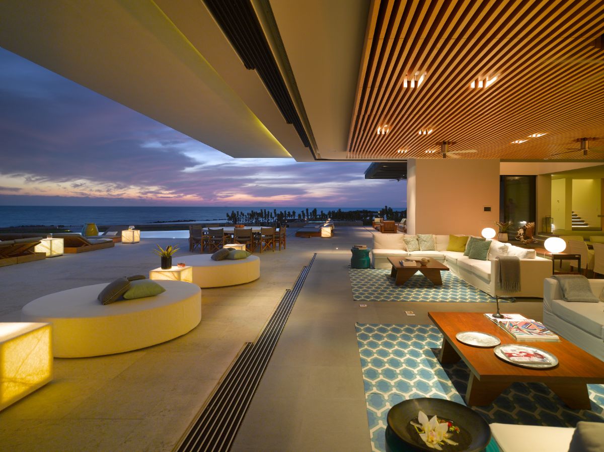 A nighttime view of the multifunctional spaces, highlighting the shimmering lights and magnificent views of the ocean and skies.