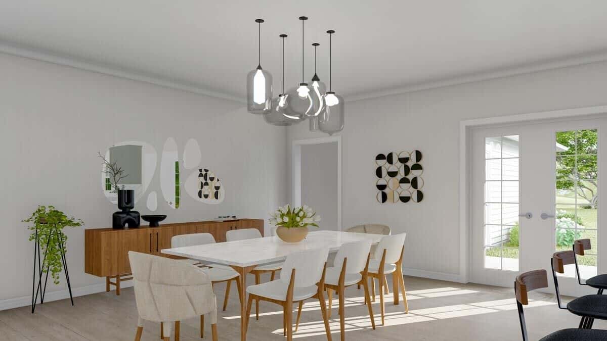 Dining area with a wooden buffet table and a white dining set topped by multiple glass pendants.