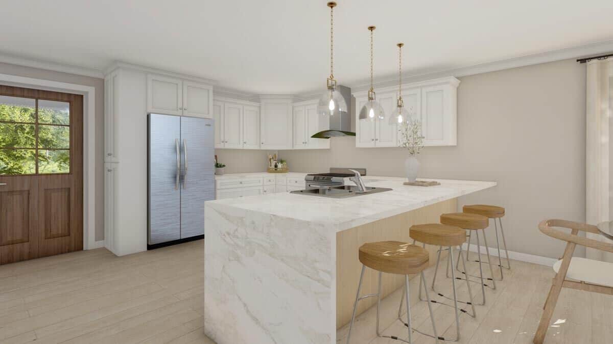Kitchen with stainless steel appliances, marble countertops, and a peninsula bar.