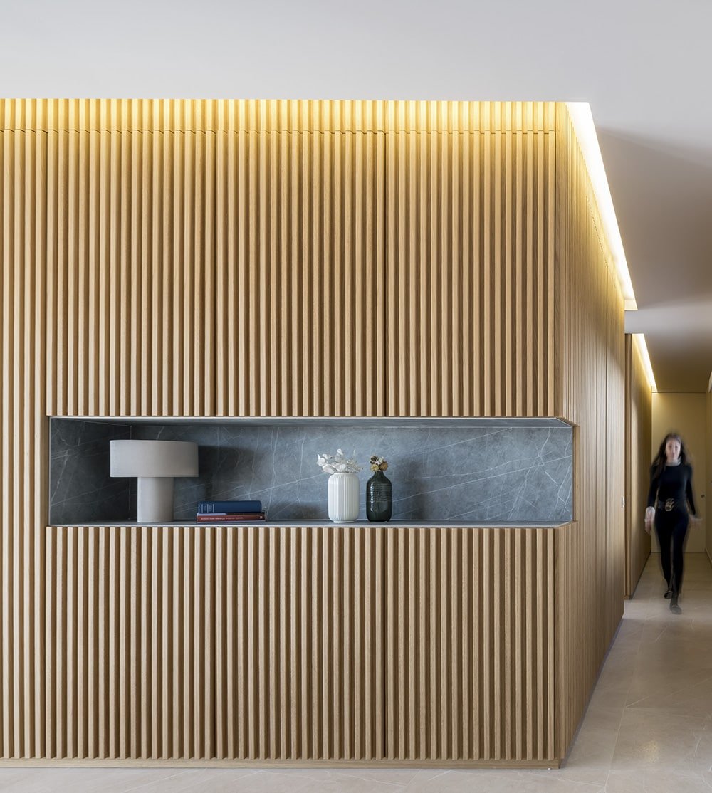 A niche in the hallway provides additional storage.