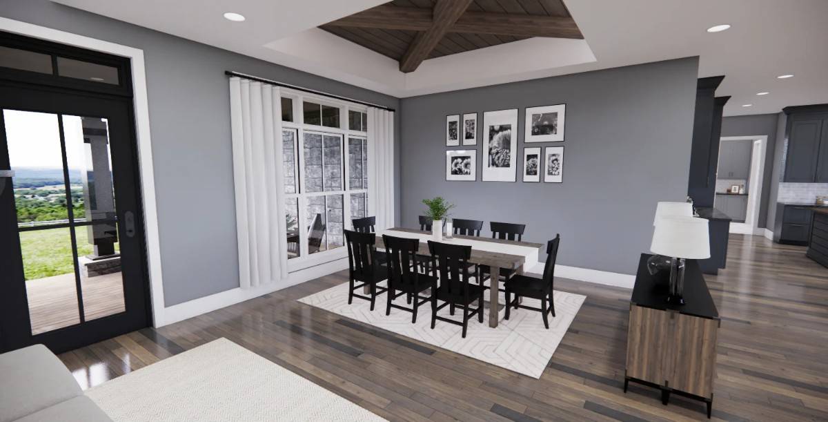 The dining room features a rustic wooden dining set and a tray ceiling accentuated with exposed beams.