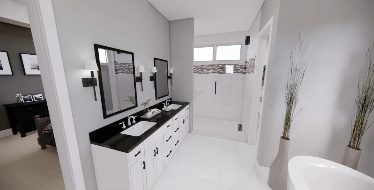 A dual sink vanity paired with framed mirrors completes the primary bathroom.