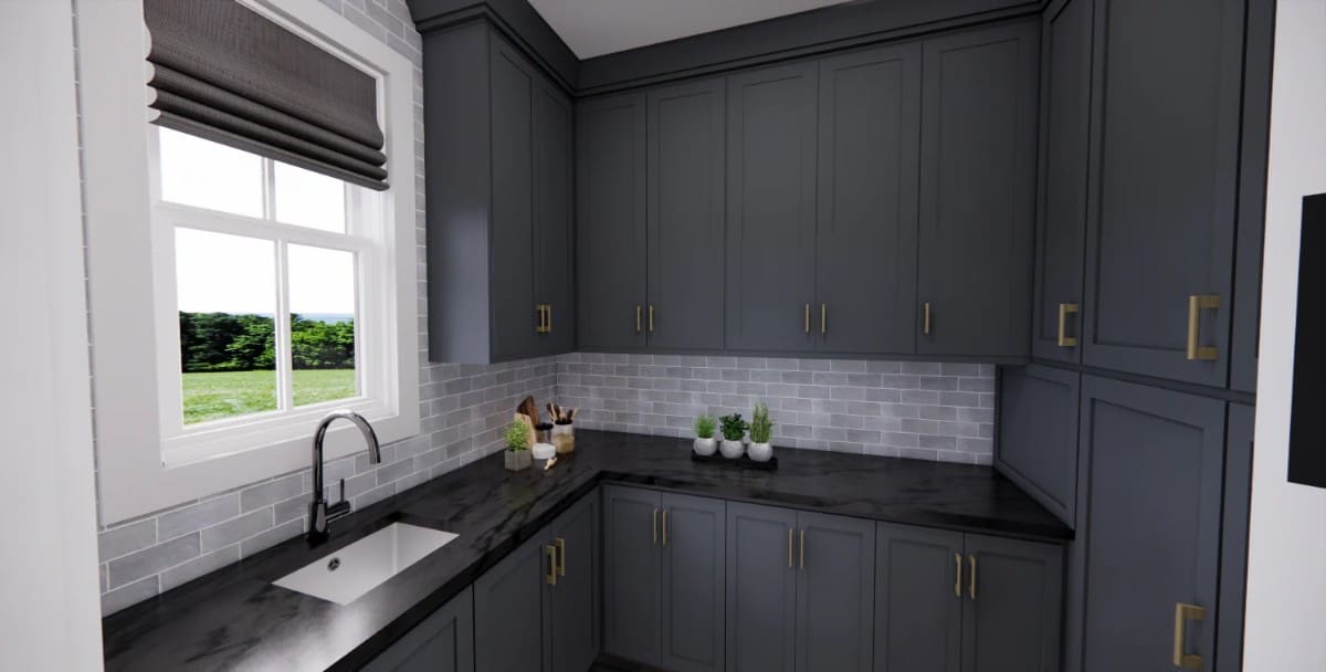 Walk-in pantry with ample storage, black marble countertops, and a sink under the window.