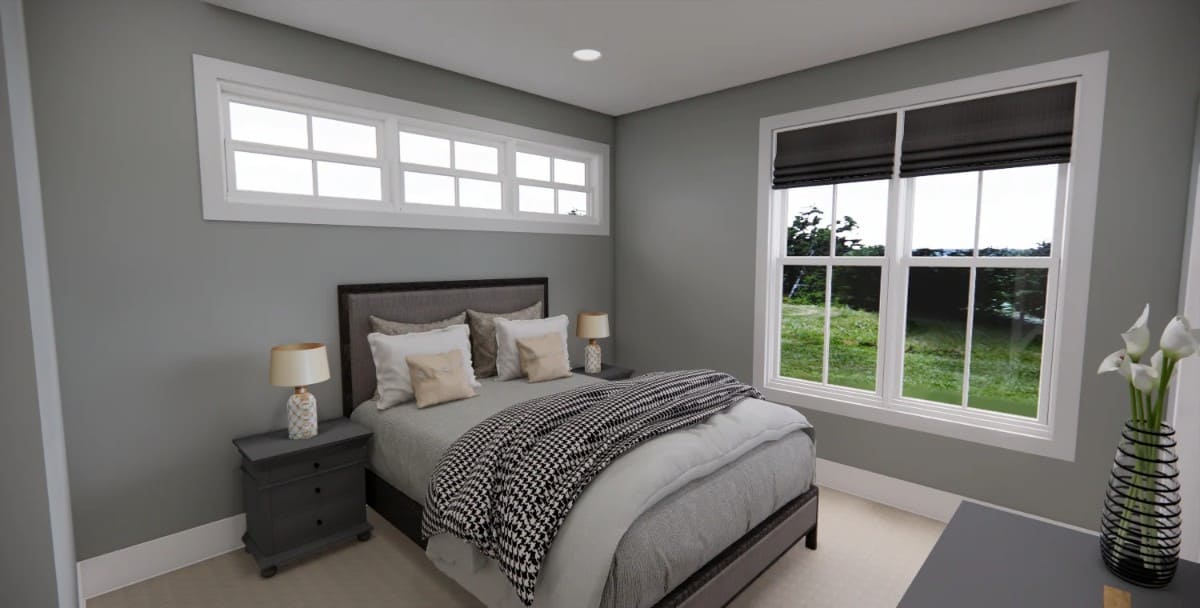 The second bedroom has gray walls and an upholstered bed topped with clerestory windows.