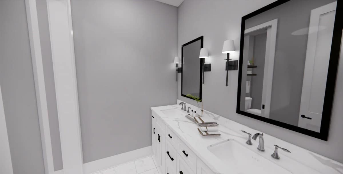 This bathroom features a white vanity with a marble countertop, double sinks, and framed mirrors.