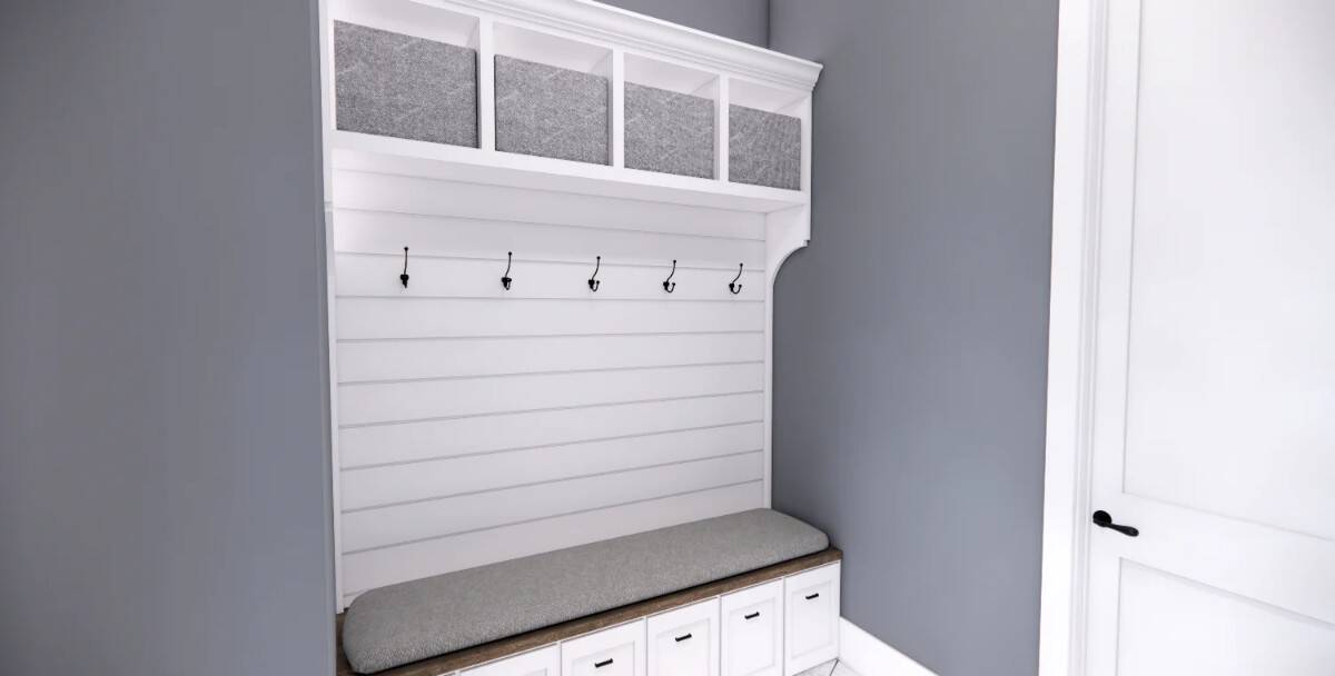 Mudroom with a cushioned bench, coat hooks, and storage shelves.