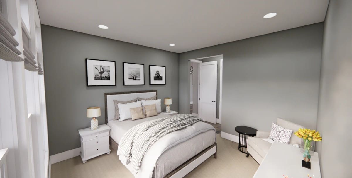 The guest bedroom has a wooden bed and a matching armchair paired with a round side table.