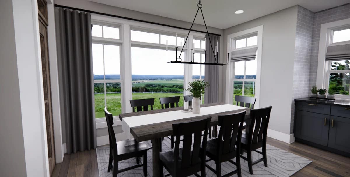 The dining room has a dark wood dining set and stunning views of the backyard.