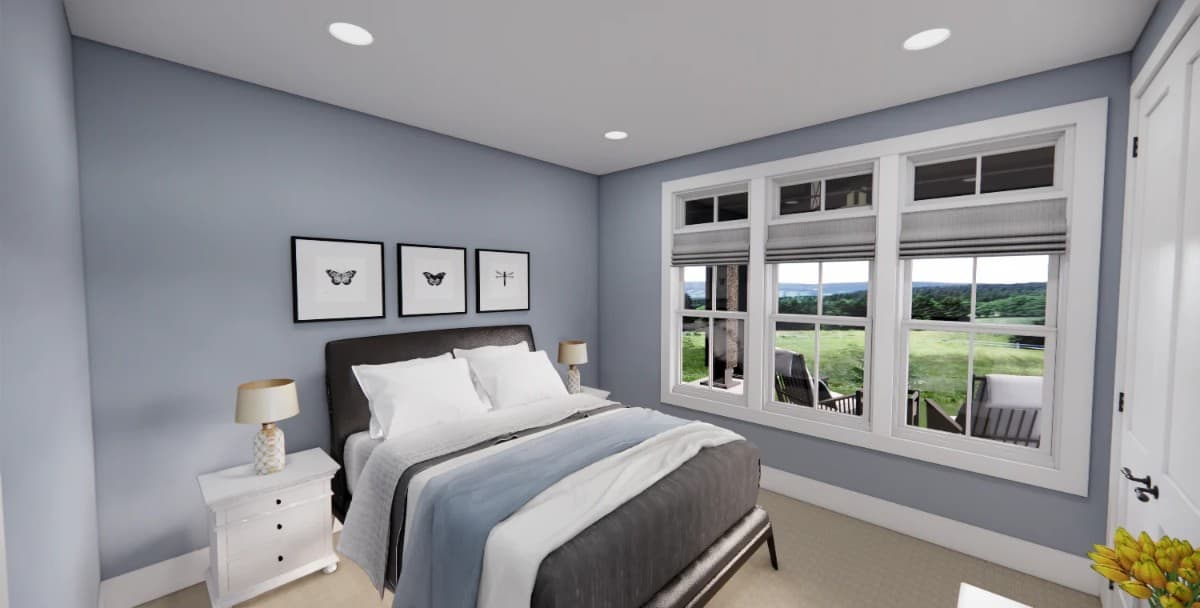 This bedroom has a carpeted floor and grayish-blue walls adorned with insect artworks.