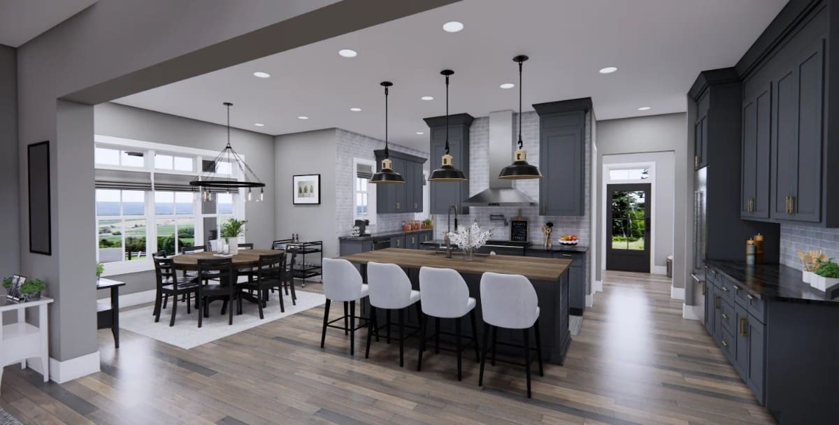 The kitchen is equipped with gray cabinetry, a center island, a prep kitchen, and an adjoining dining area.
