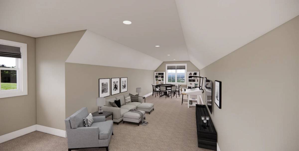 Recreation room with multiple seating areas under a vaulted ceiling.