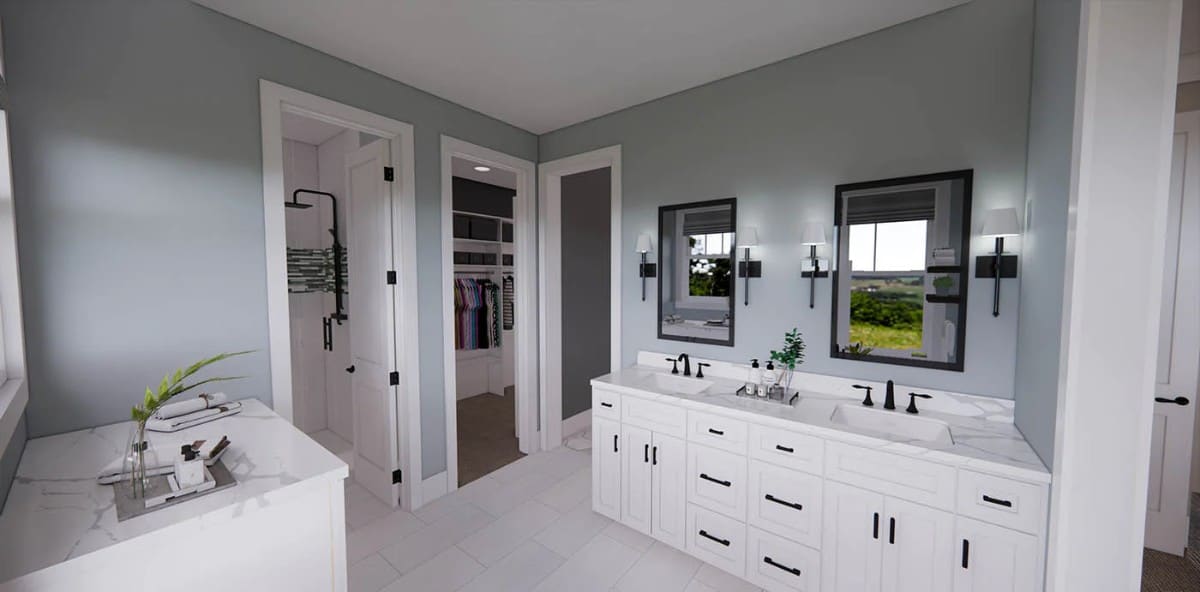 The primary bathroom has a dual sink vanity, an additional counter space, a tiled shower, and a walk-in closet.