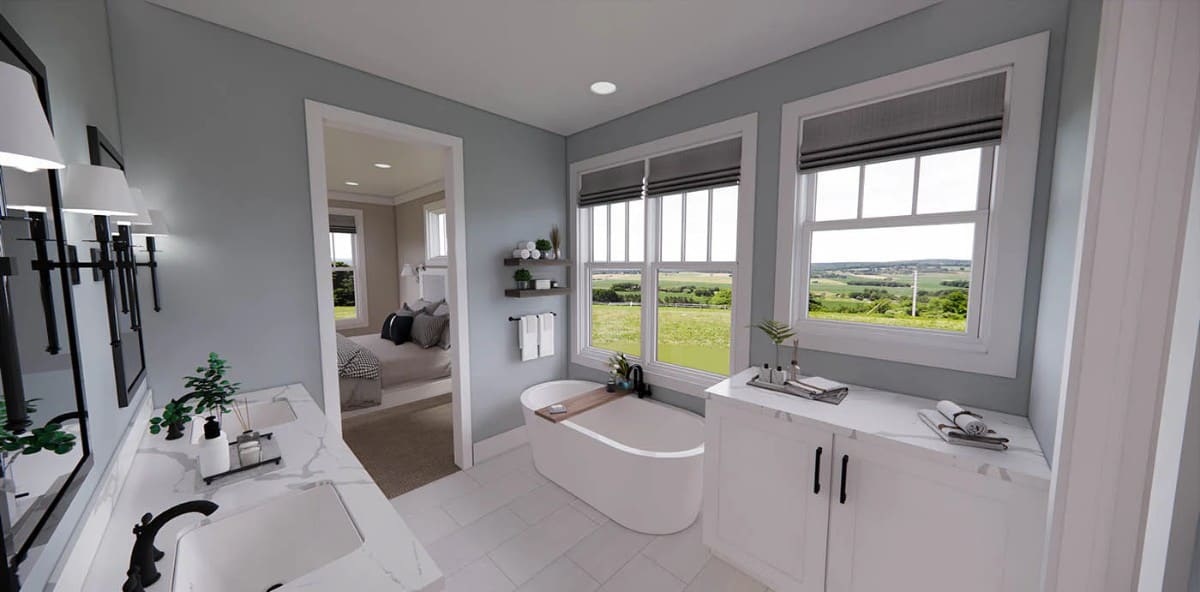 A freestanding tub with expansive views completes the primary bathroom.