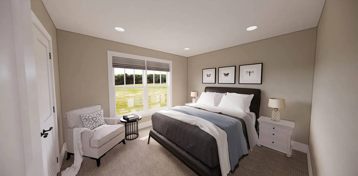 Third bedroom with a gray armchair and a leather upholstered bed flanked by contrasting nightstands.