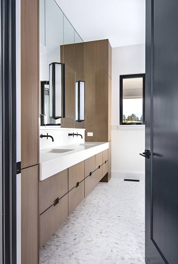 The primary bathroom features a dual sink vanity paired with a large paneled mirror.