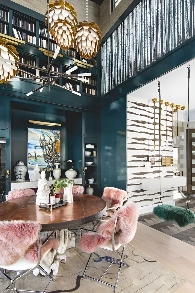 Dining area with contemporary lighting fixtures, a round dining set, and a built-in buffet cabinet.