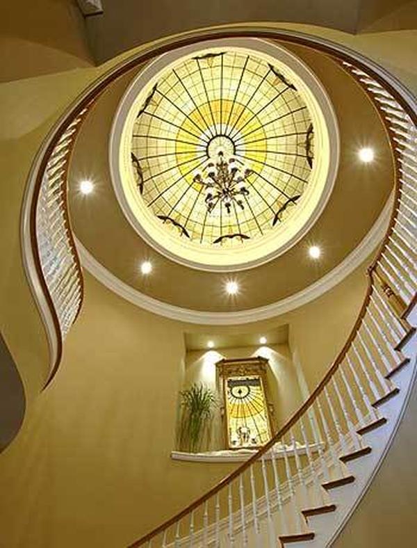 View of the winding staircase and stunning dome ceiling from below.