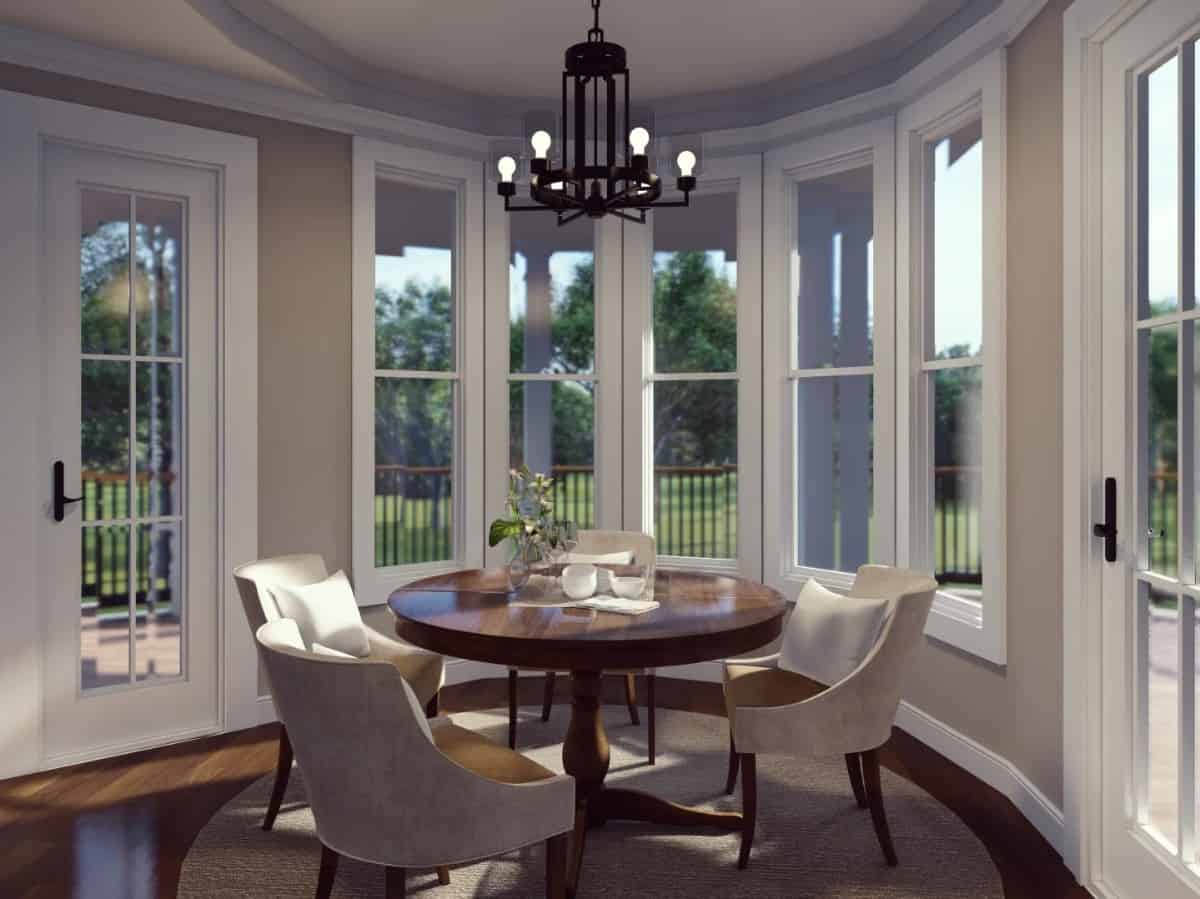 The breakfast nook offers a round dining set and direct access to the rear deck.