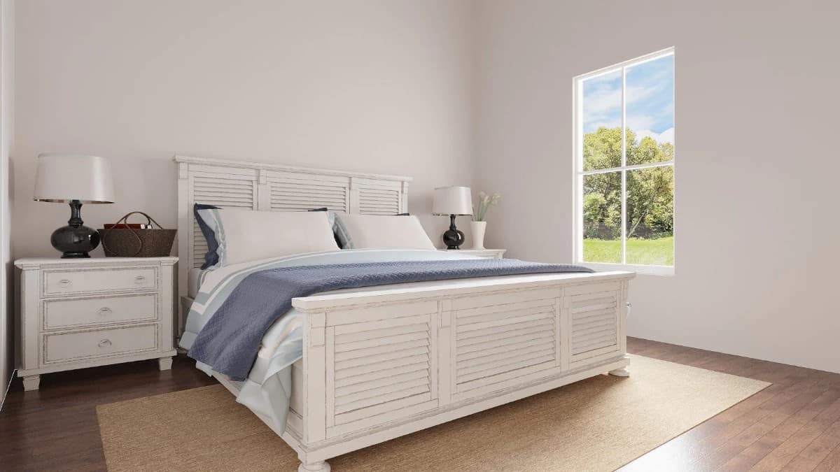 The third bedroom has white furnishings blending in with the white walls.